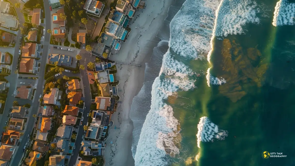 Coastal real estate in the U.S. facing rising sea levels and climate change challenges, with homes and businesses at risk of flooding.