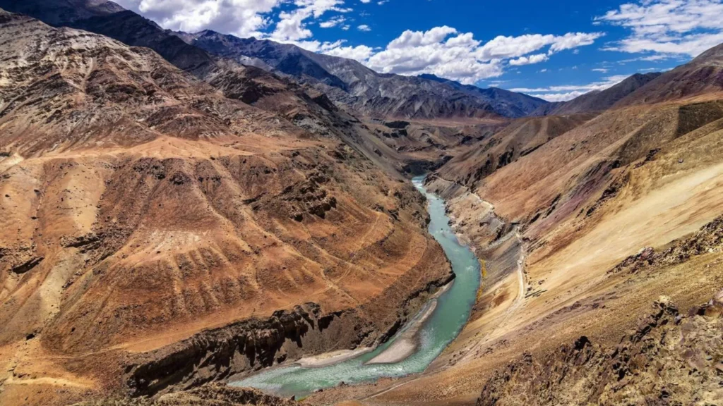 A breathtaking view of Indus Gorge, Pakistan, where the Indus River carves through the rugged mountains, creating one of the deepest gorges in the world.