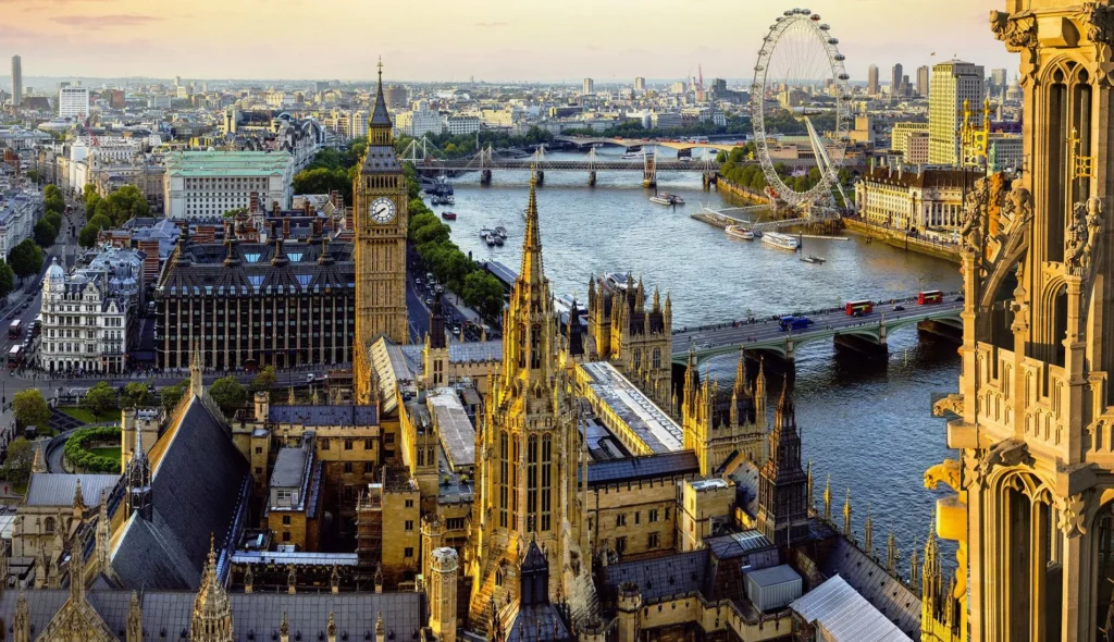 A stunning aerial view of London, UK, featuring Big Ben, the Houses of Parliament, and the River Thames.