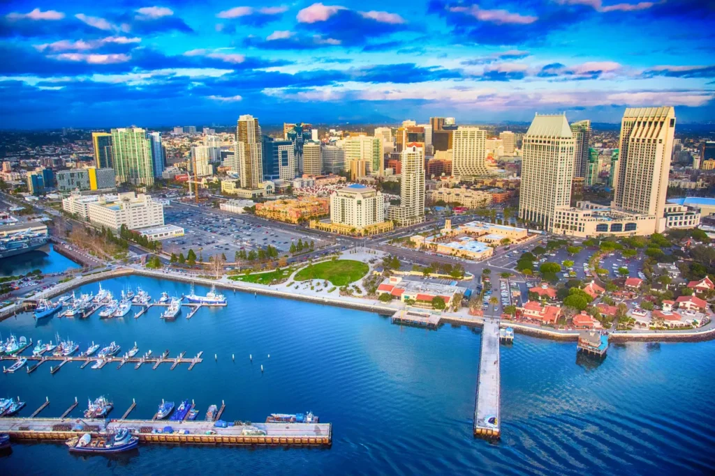 San Diego, California – A stunning aerial view of the city’s skyline, waterfront, and marina under a vibrant blue sky.