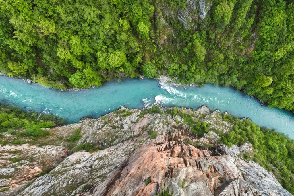 Tara River Canyon, Montenegro – Europe's deepest river canyon, featuring emerald waters, lush greenery, and breathtaking cliffs.