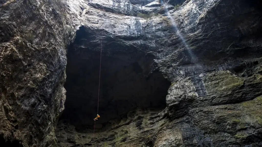 Giant sinkholes exploration – A climber descends into Xiaoxhai Tiankeng, the world's biggest sinkhole in China.