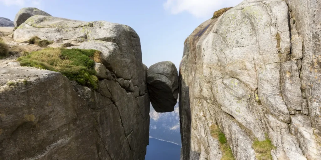 Thrilling Tourist Spots: 15 Mind-Blowing Destinations Built for Pure Adrenaline 14 Thrilling Tourist Spots - Kjeragbolten, Norway