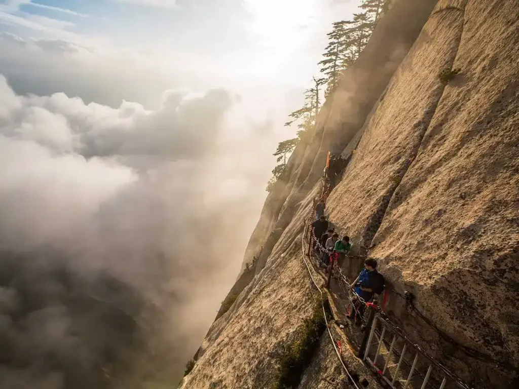 Thrilling Tourist Spots: 15 Mind-Blowing Destinations Built for Pure Adrenaline 3 Thrilling Tourist Spots - Mount Huashan Plank Walk, China